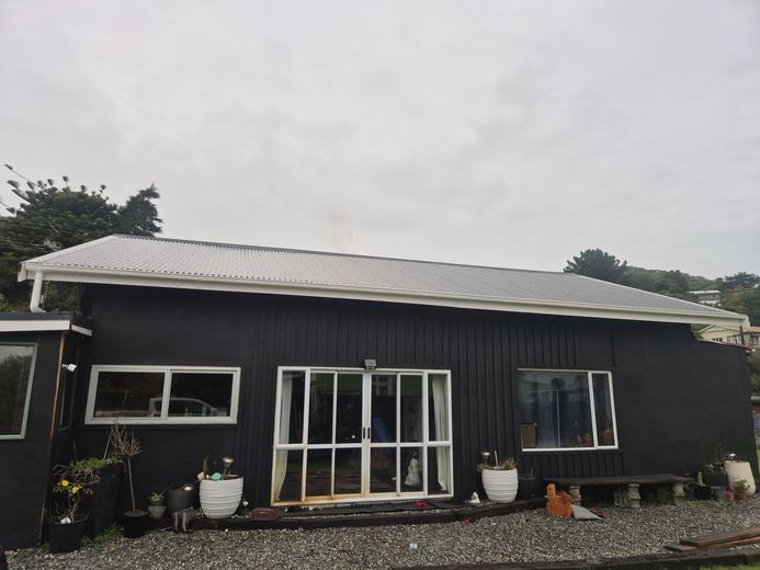 Finished re-roof on a black cottage