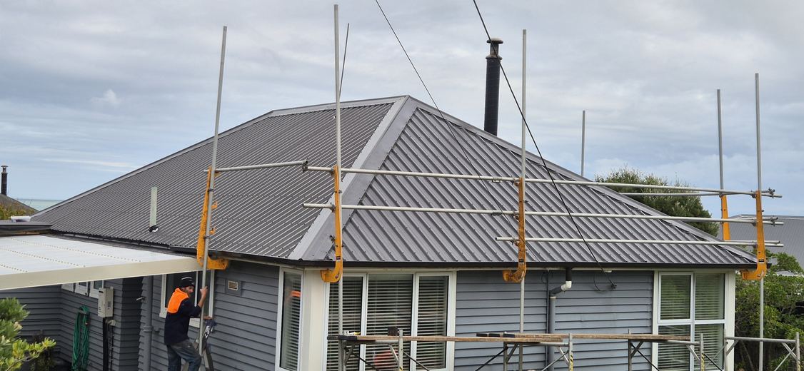 Hip re-roof in progress with scaffold