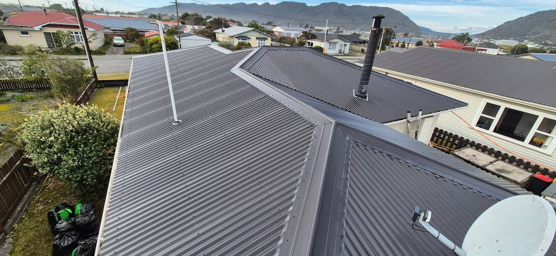 Finished re-roof with Greymouth and the hills behind